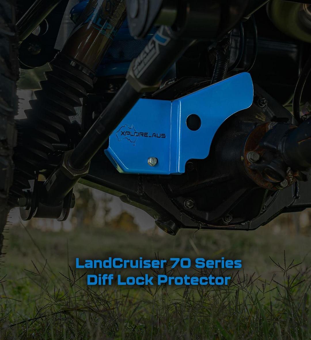 Blue Diff Lock Protector on a LandCruiser 70 Series vehicle with grass in the background