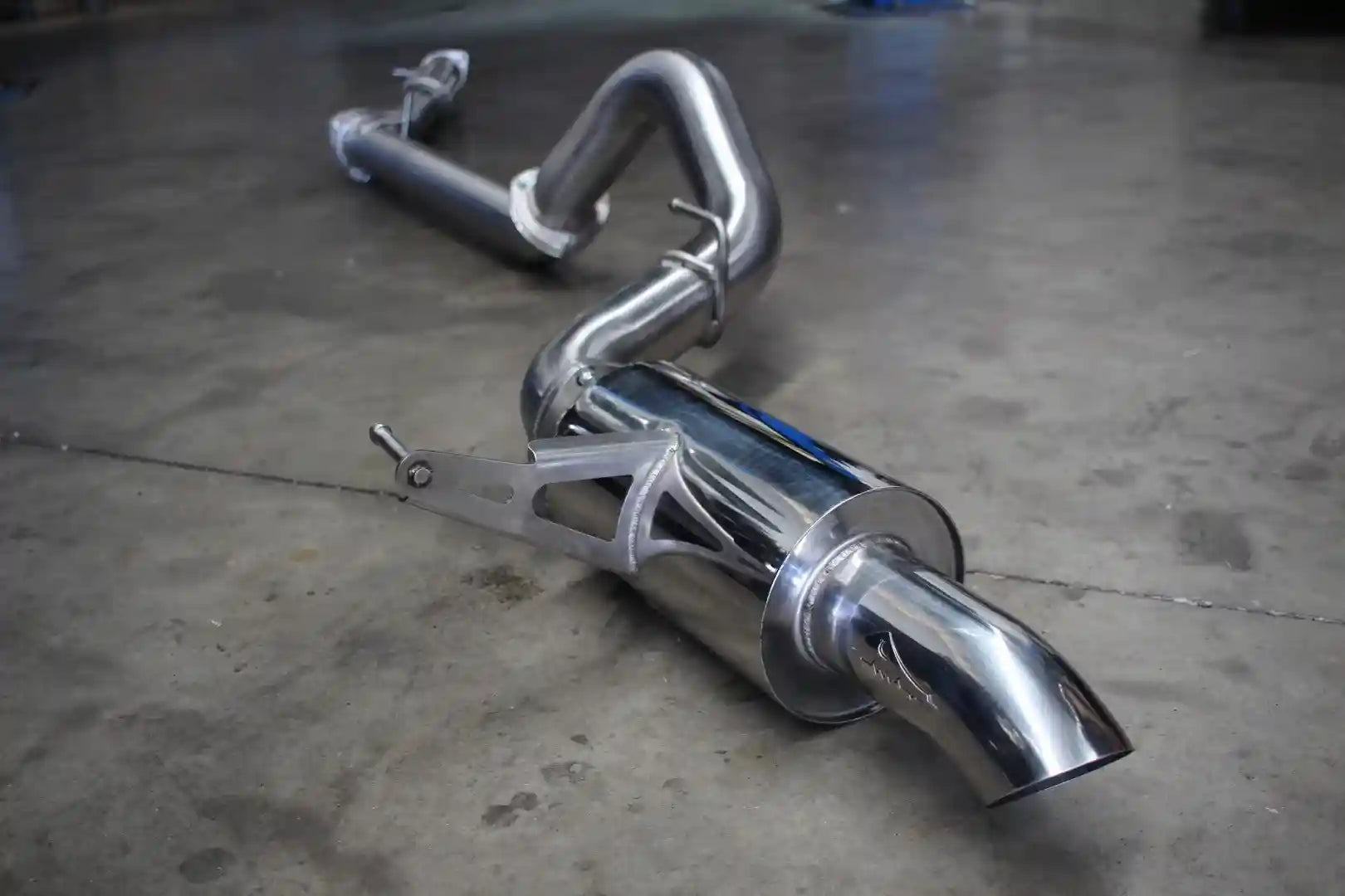 Chrome exhaust system on a concrete floor