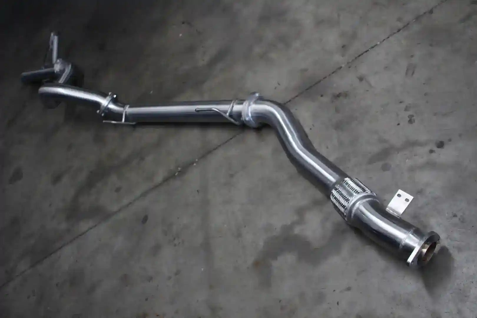 Car exhaust pipe on a concrete floor