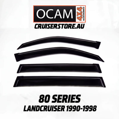 Set of black window deflectors for 80 Series LandCruiser 1990-1998 with OCAM 4x4 Accessories branding.