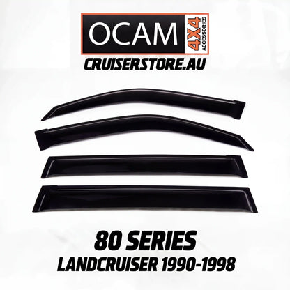 Set of black window deflectors for 80 Series LandCruiser 1990-1998 with OCAM 4x4 Accessories branding.