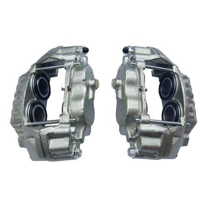 Two metallic brake calipers on a white background