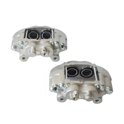 Two metallic brakes on a white background