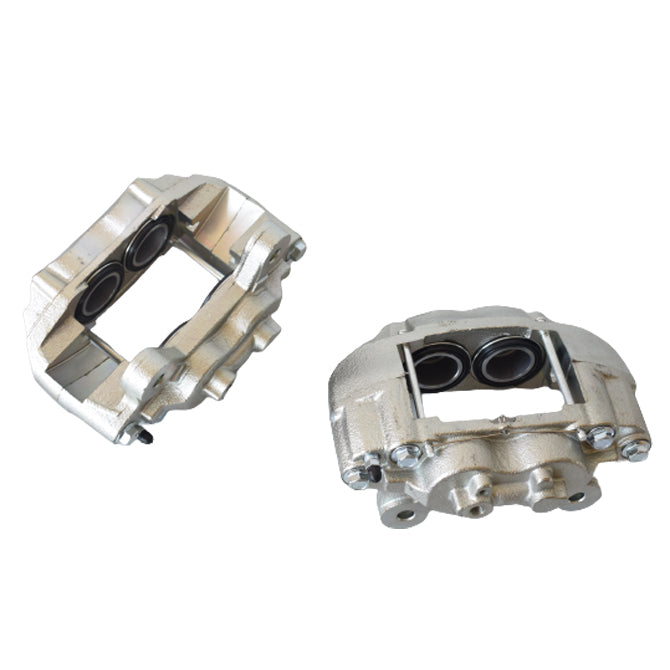 Two metallic metal brake calipers on a white background