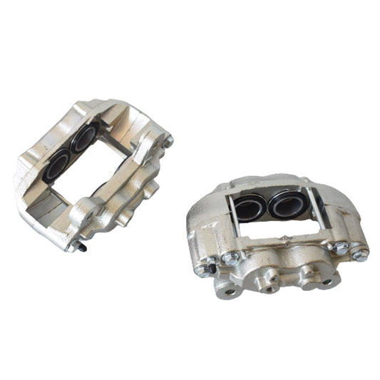 Two metallic metal brake calipers on a white background
