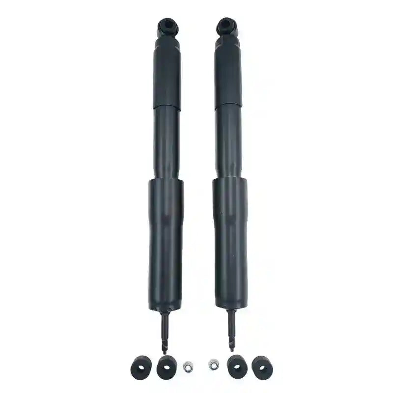 Two black shock absorbers with mounting hardware on a white background