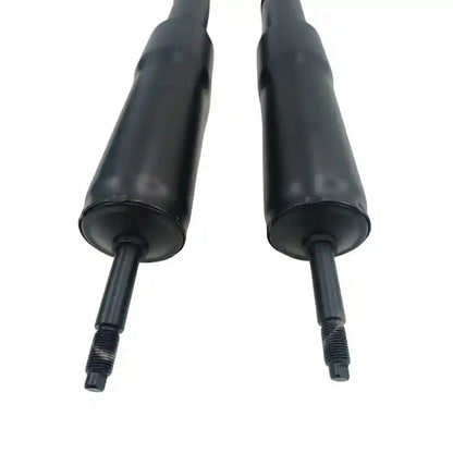 Two black metal shafts on a white background