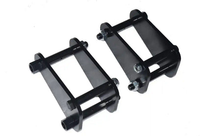 Two black metal Front Extended Shackles on a white background