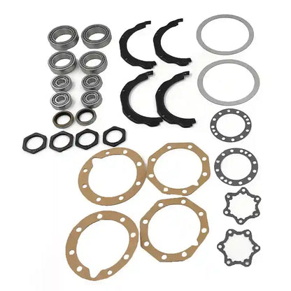 Collection of mechanical parts including bearings, washers, and gaskets on a white background