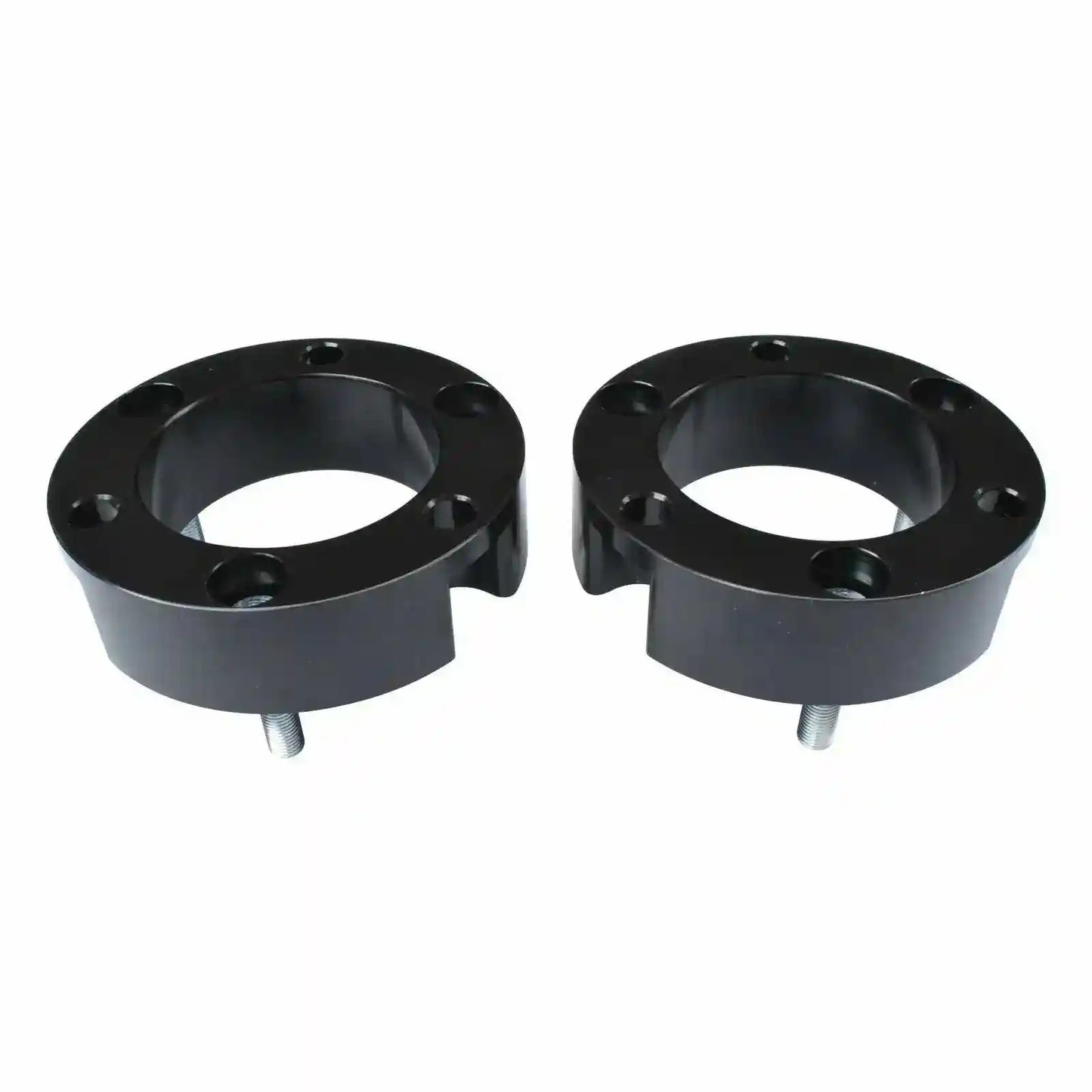 Two black Coil Strut Shock spacers on a white background