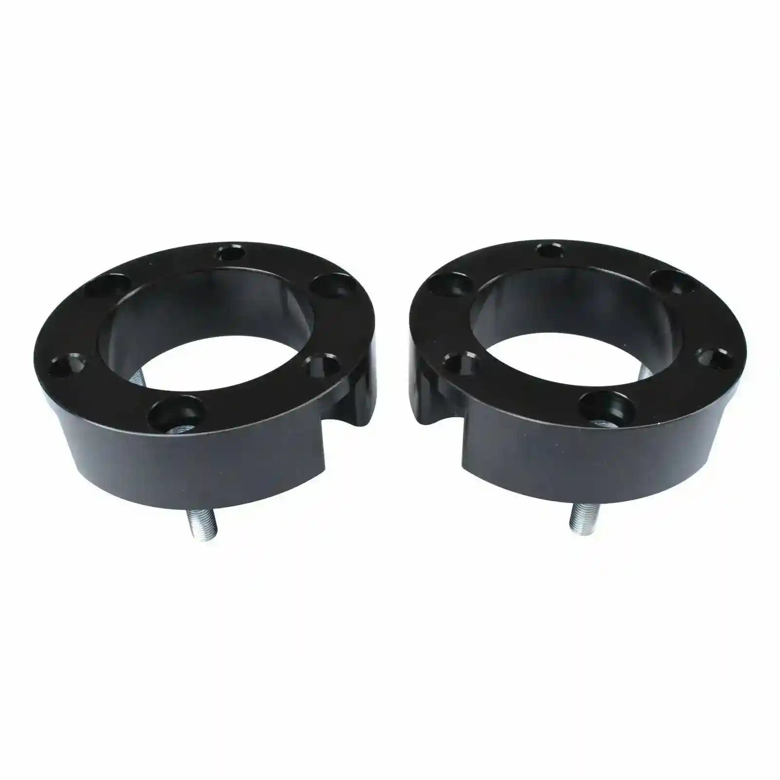 Two black Coil Strut Shock spacers on a white background