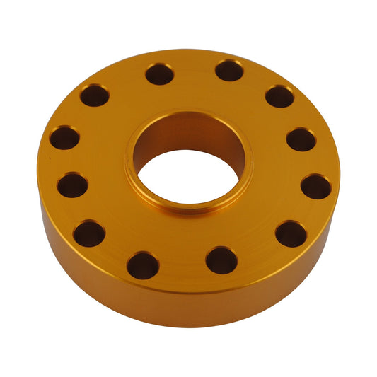 Gold metal flange with multiple holes on a white background
