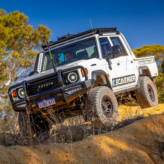 Toyota off-road vehicle on a rocky terrain with 'Scavenger' branding.
