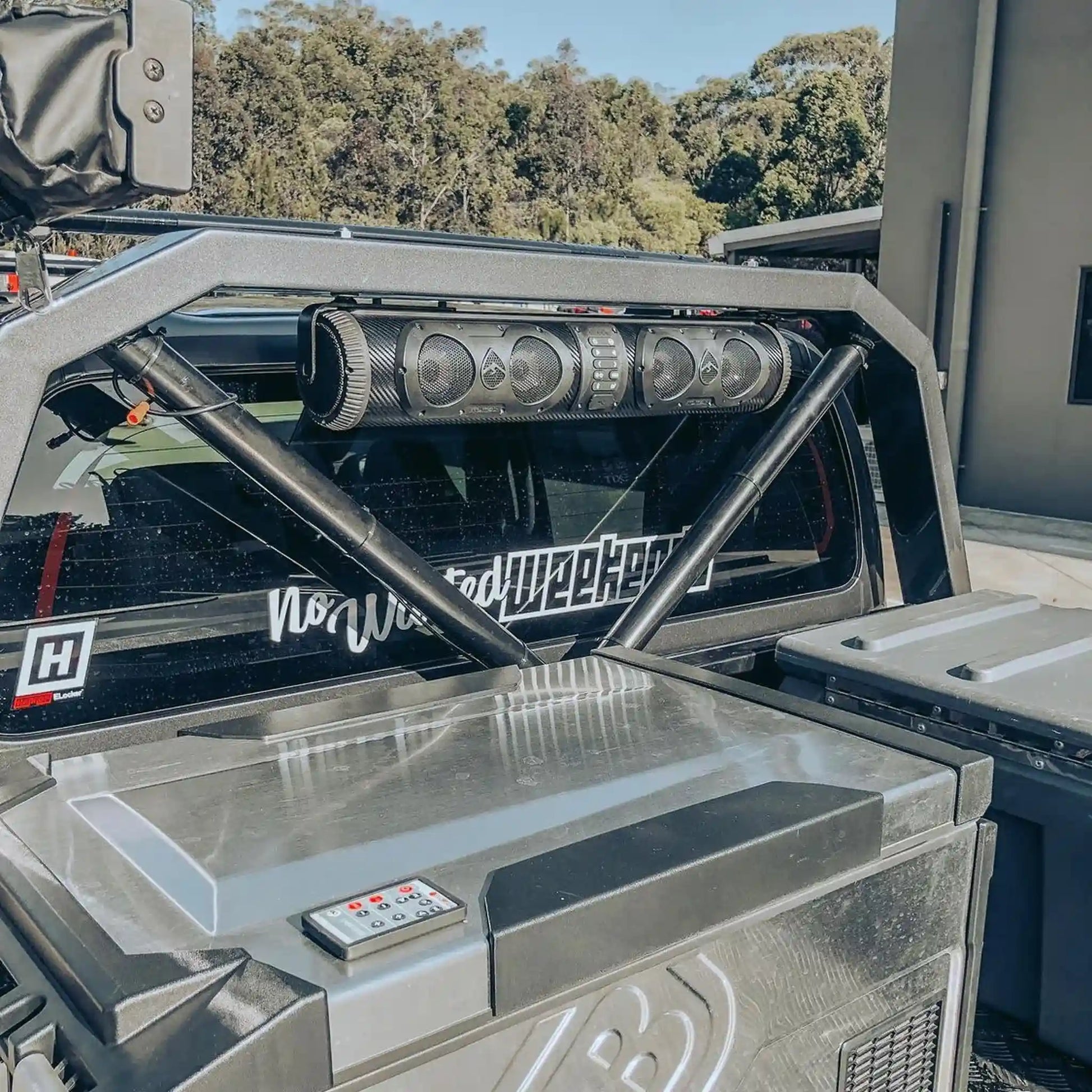 Close-up of a vehicle's open cargo area with visible branding and design elements.
