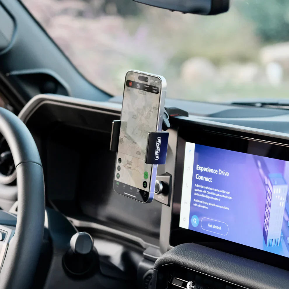 Phone mounted on a car dashboard with a navigation app displayed