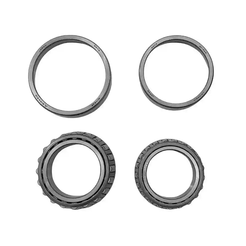 Four metallic bearings on a white background