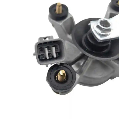 Close-up of a Windscreen Wiper Motor with connectors on a white background