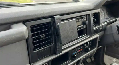 ClicOn angled dash mounting bracket installed on a classic 1984 to 2007 Toyota LandCruiser centre console without drilling