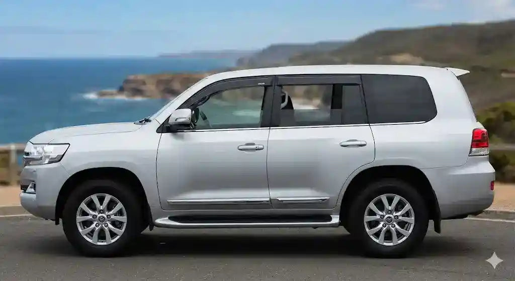 Side profile of Silver Toyota LandCruiser 200 Series Sahara with OCAM weather shields on front and rear windows.