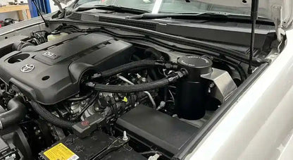 Direction-Plus ProVent catch can kit installed in a Toyota Prado 120 Series engine bay