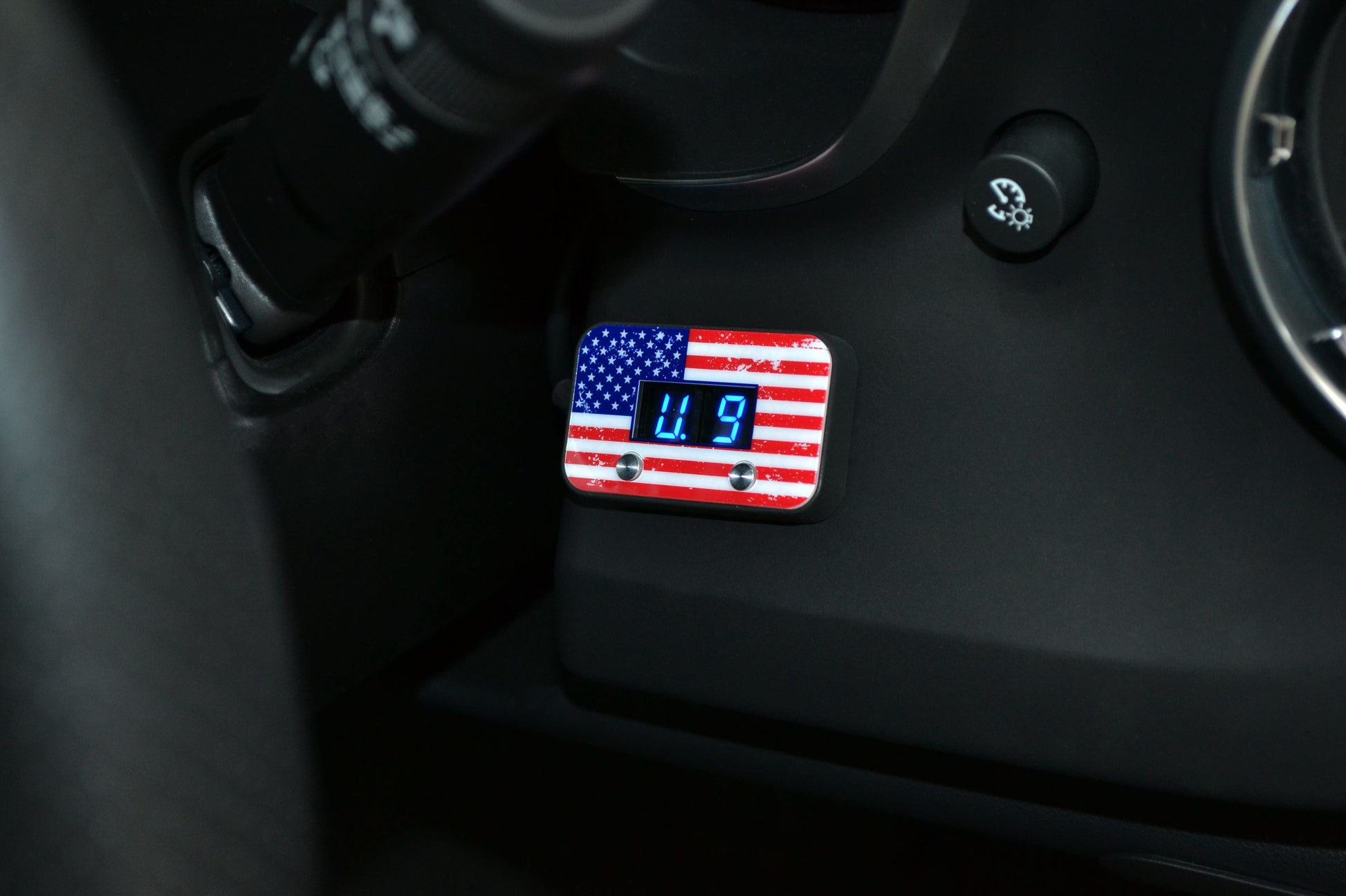 Digital gauge with American flag design inside a vehicle