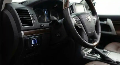 Interior view of Toyota LandCruiser 200 Series Sahara dashboard showing Ultimate9 EVC Throttle Controller mounted near the start button.