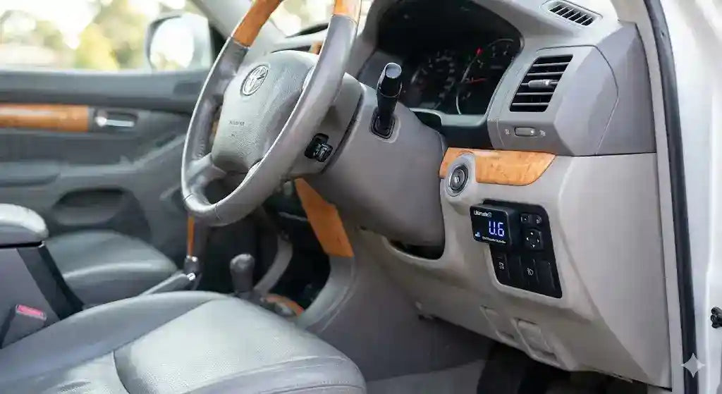 Interior view of Toyota Prado 120 Series Grande dashboard showing Ultimate9 EVC Throttle Controller.