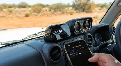 Interior of Toyota LandCruiser 79 Series (2024 Facelift) showing Ultimate9 evcX Throttle Controller and Smartphone App.